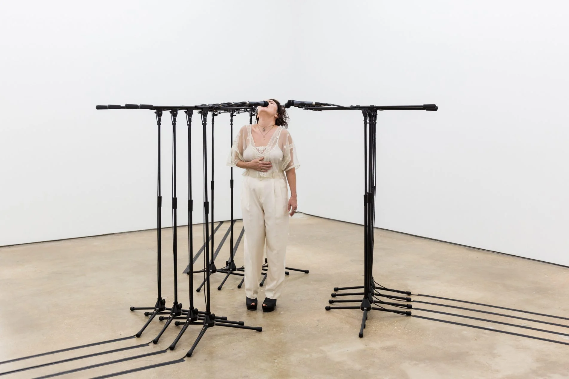 Barricade #3 , 2016, 12 microphones and microphone stands and matching audio equipment, 62 × 98 × 98 in. Photo: Diana Larrea.