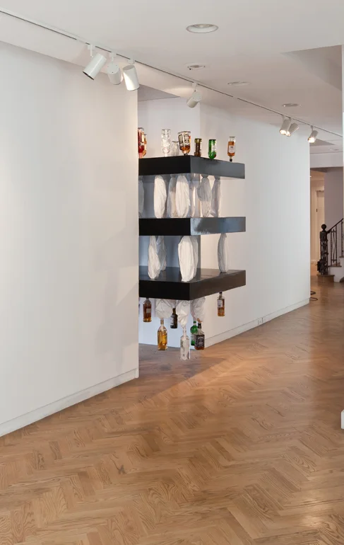 SWEAT (2) , 2011, Bed sheets, liquor bottles, MDF, Dimensions variable. From the exhibition Involuntary curated by Neville Wakefield .
