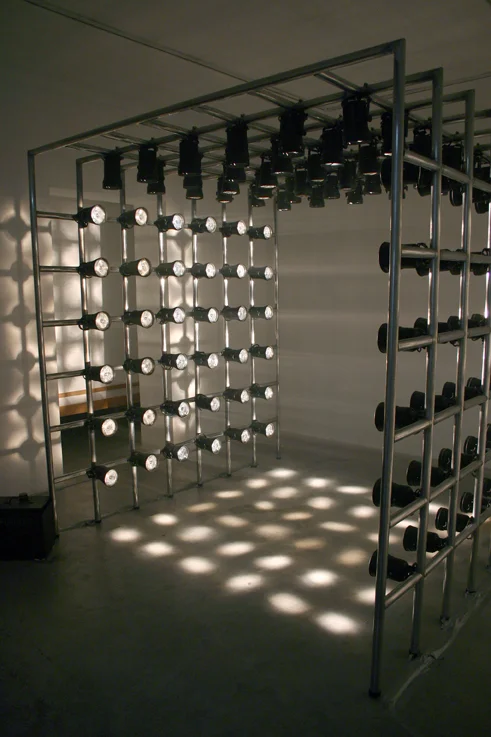 Untitled (Light Cube) , 2004, Aluminum poles, pin spot lights, fog machine, 6.8' x 6.8' x 6.8'. *Image from Sommer Gallery