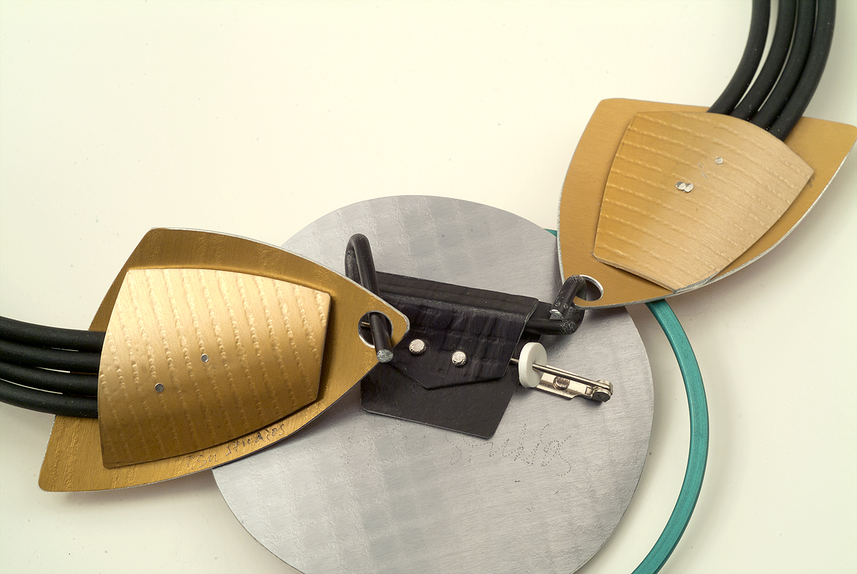 5. Slide end of neckpiece onto long hook.