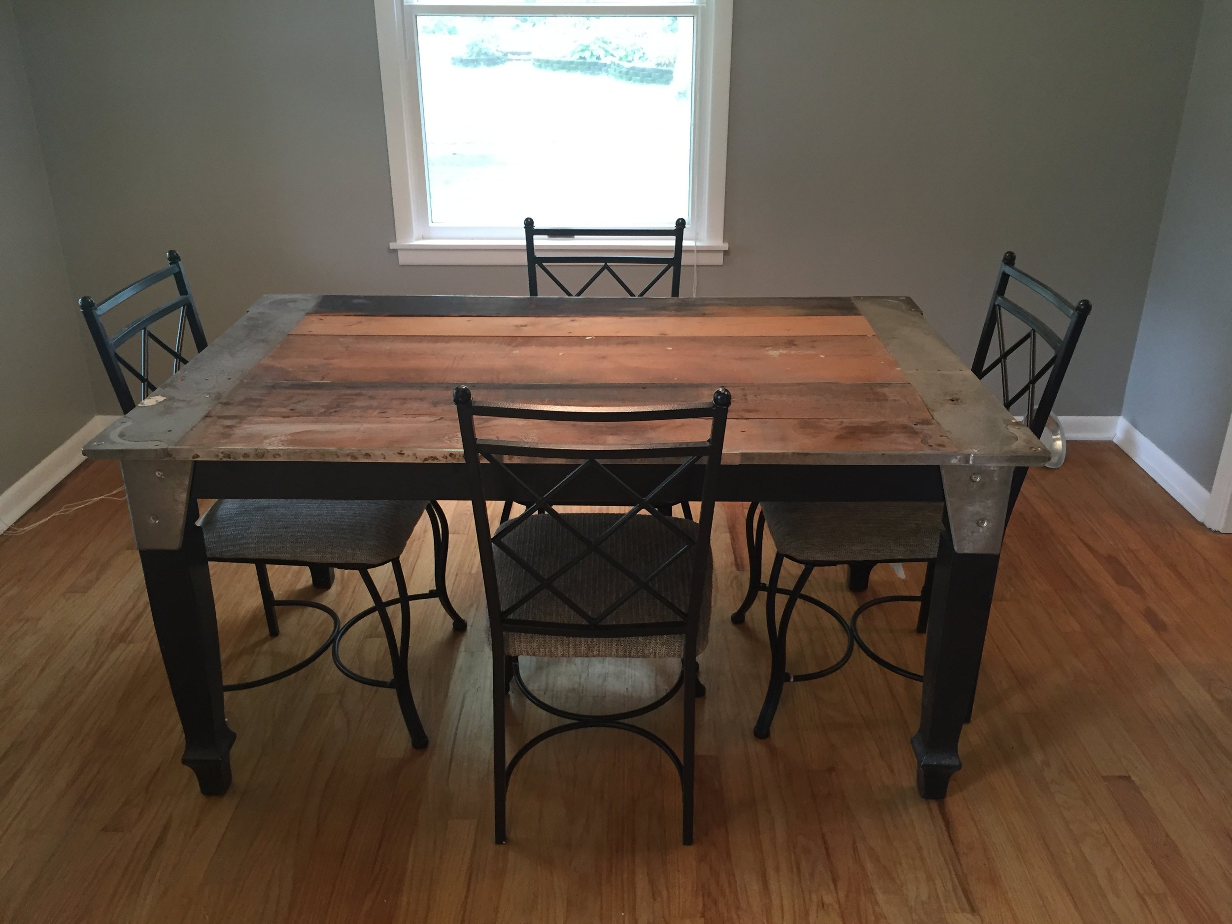The dining room table Aaron made me. He even engineered a way for it to have an extension! He salvaged trim details from our old pool table in the basement of old house and used them on the table. I love it madly.
