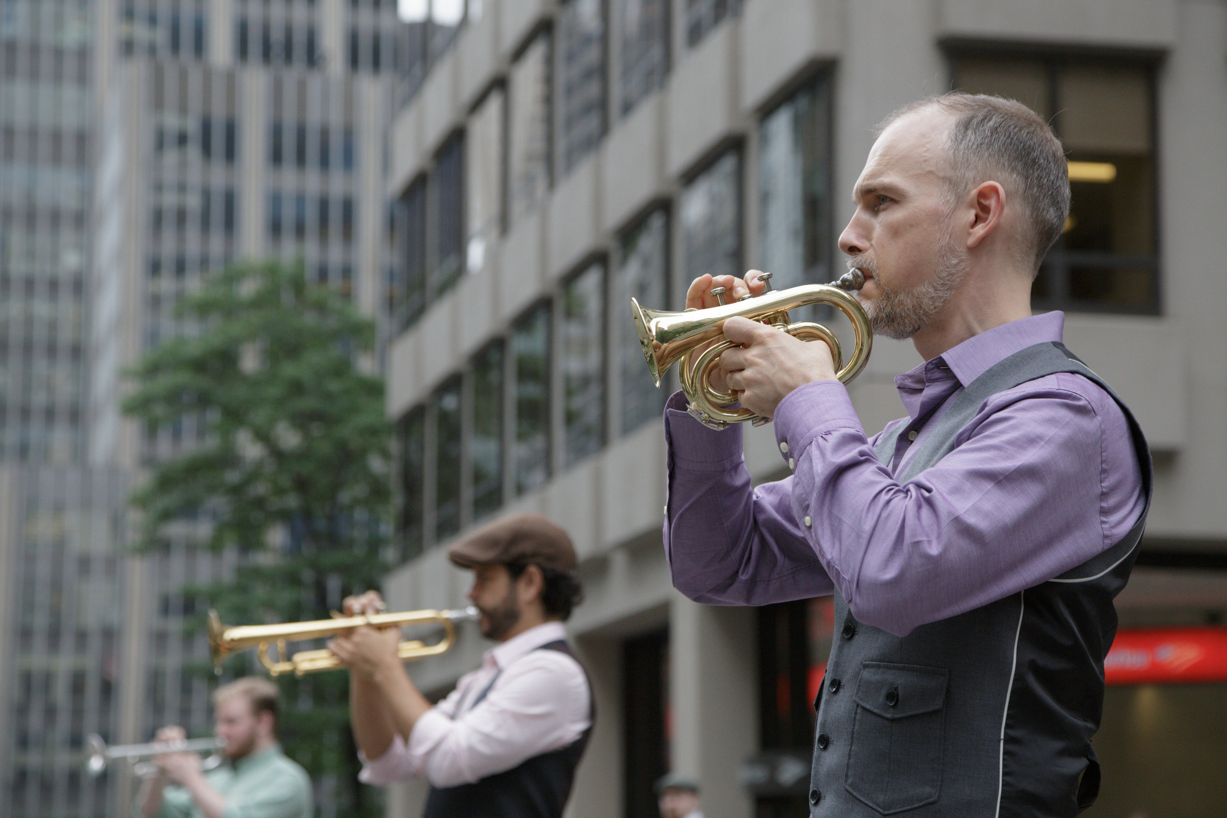  From R: Craig Shepard, Phil Rodriguez, Cyril Bodnar perform on Park Avenue in New York. Photo by Beth O’Brien 