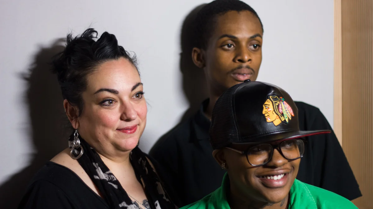 Kasey, Anthony, and Maria have their photo taken in the storycorps sound booth
