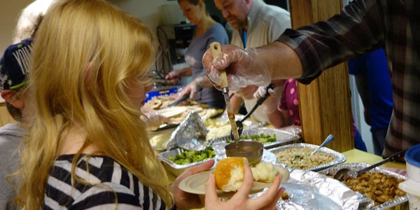 Girl-being-served-at-Thanksgiving-Dinner.jpg
