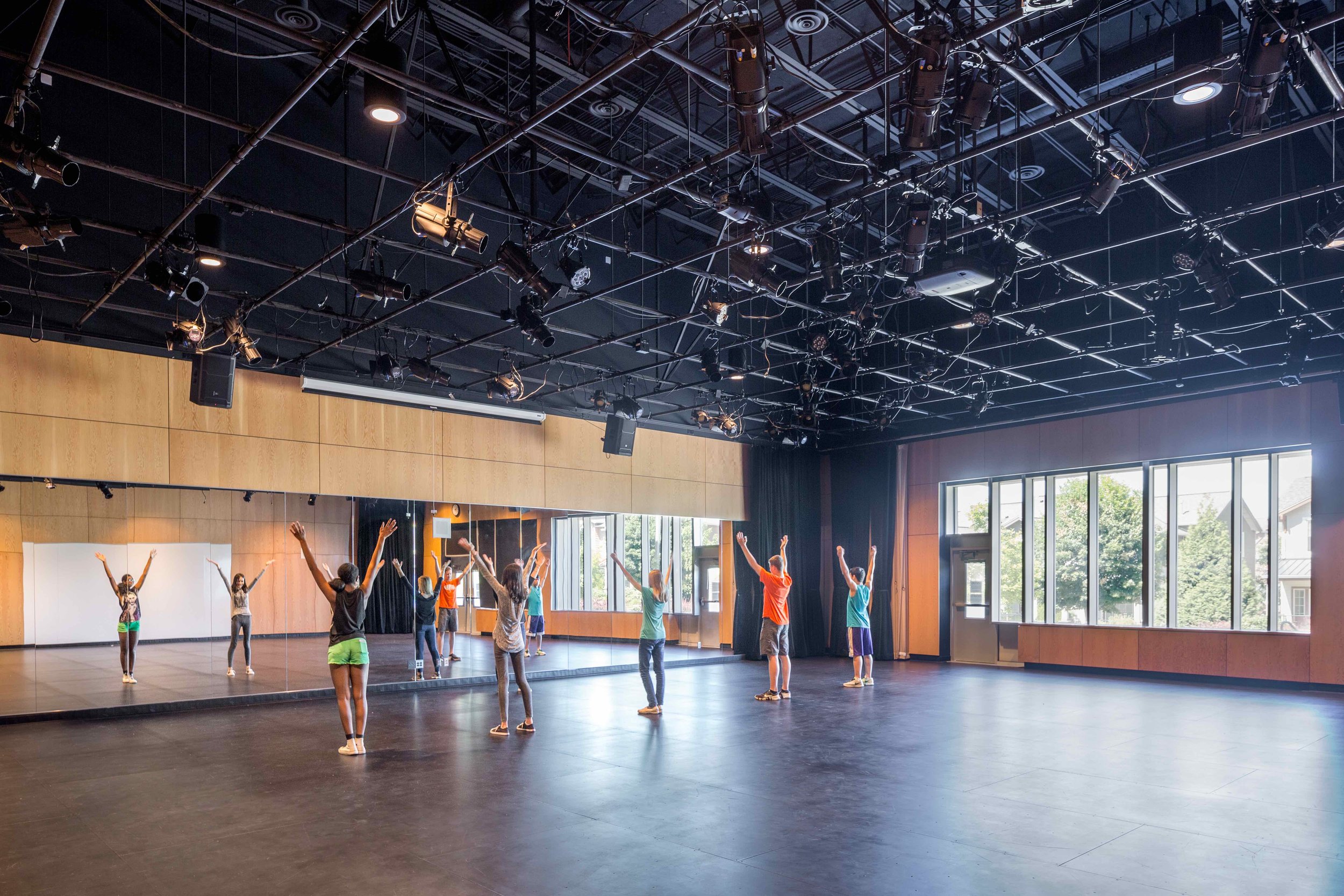 The black box multipurpose room serves theater programs as well as yoga and physical education. Image copyright Mahlum Architects.