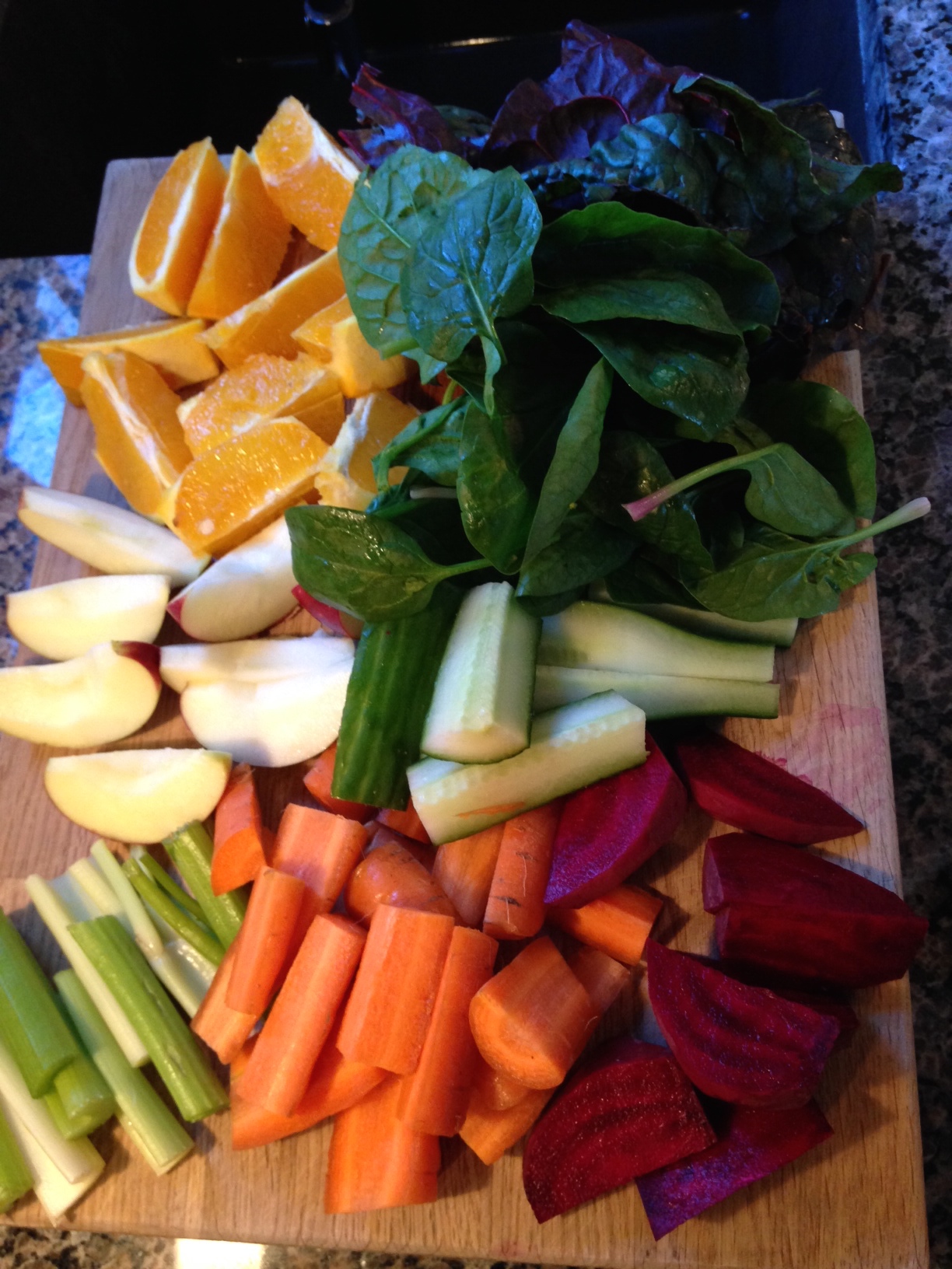 Sunday morning juice ingredients: carrot, beet, celery, apple, cucumber, orange, swiss chard and spinach.