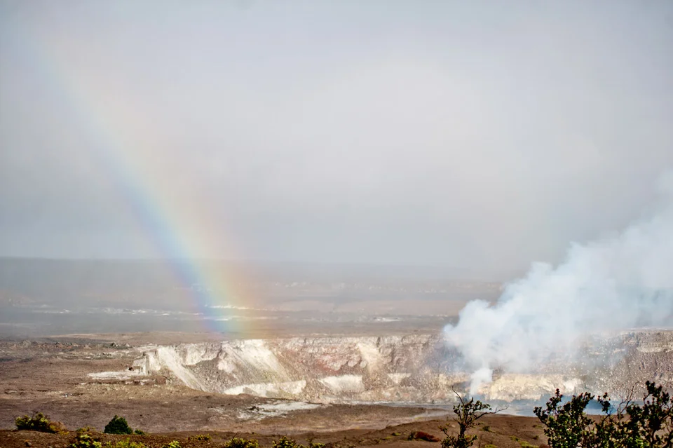 Rainbow drops into the Crater at Volcano National Park on the Big Island of Hawai'i