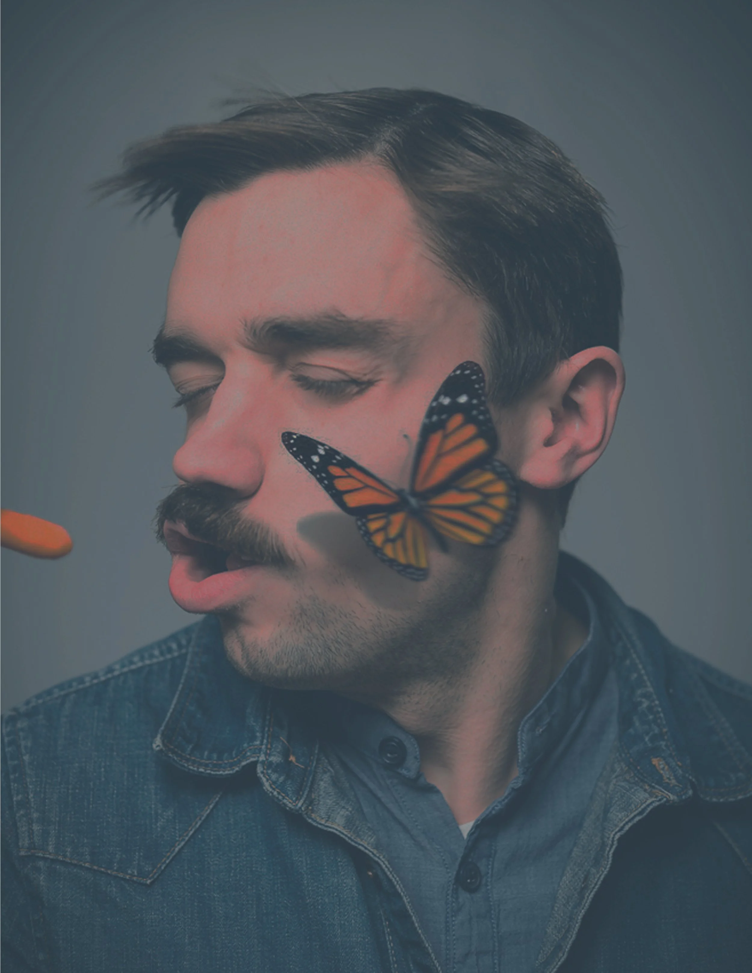 A man with closed eyes and a mustache has a butterfly perched on his nose.