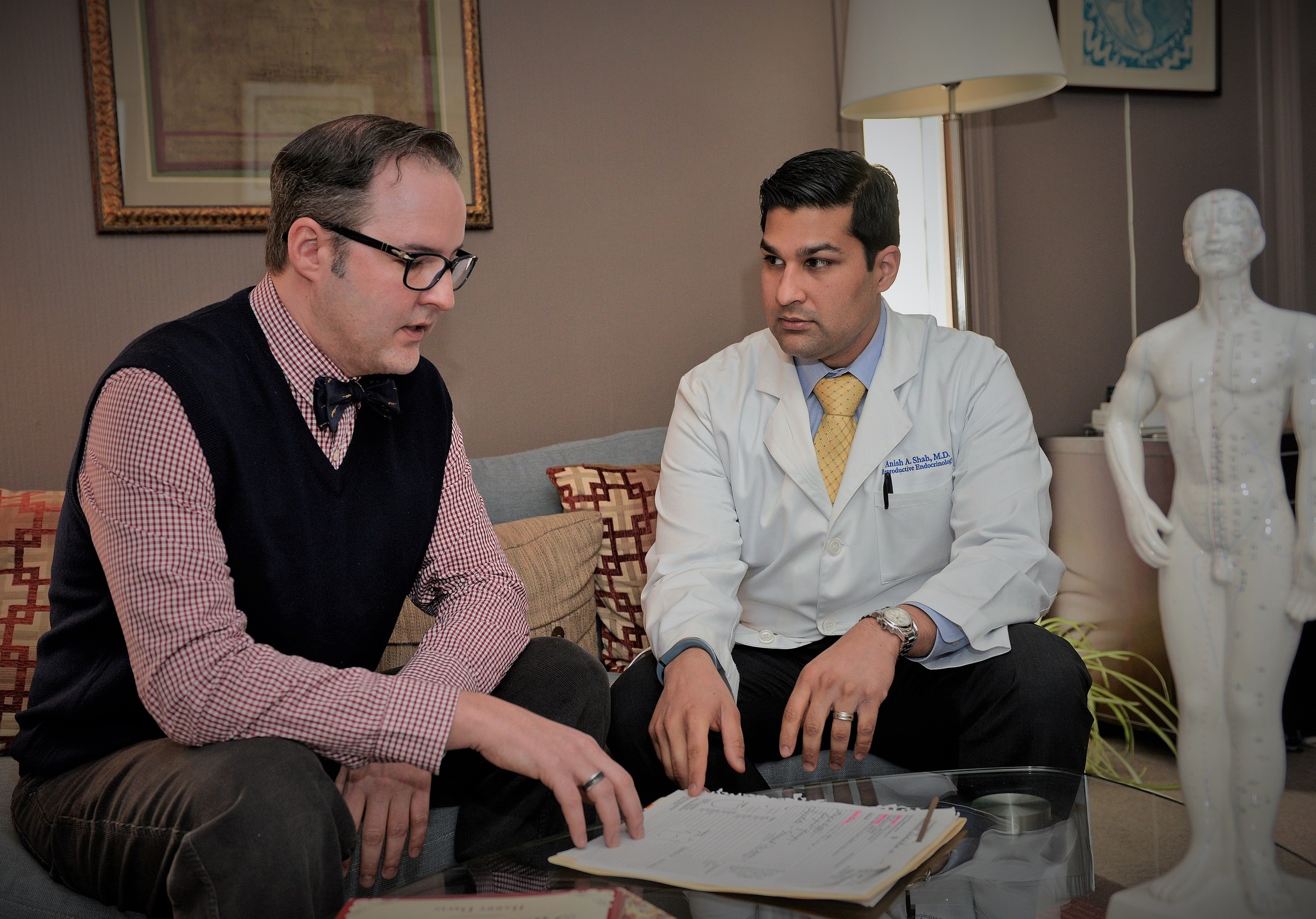 Keith Bell & Dr. Anish Shah meeting to discuss patient care.