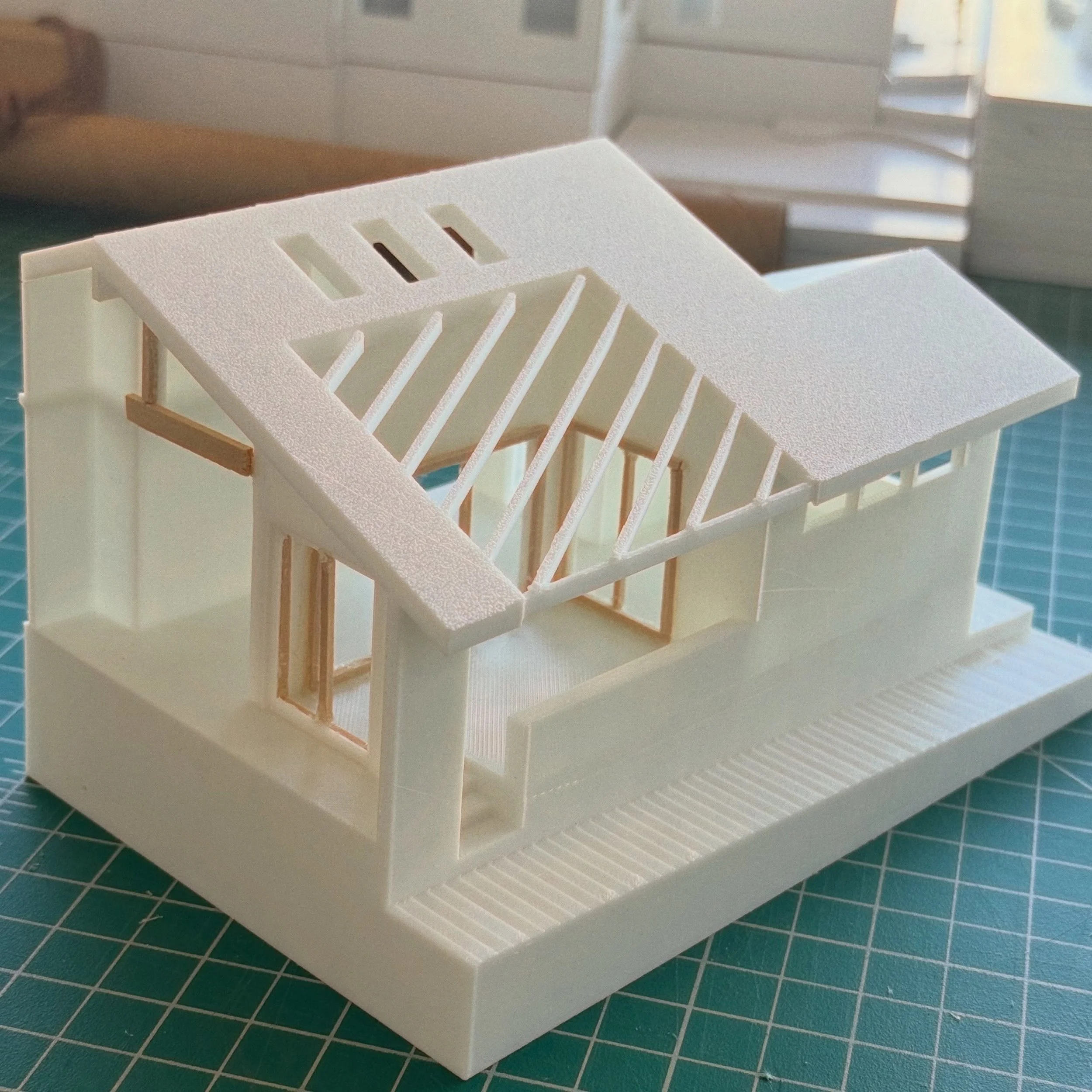 Athens St, Altadena, CA - A study in light, structure, and enclosure.

The roof is opened selectively to bring daylight deep into the plan, while the exposed framing defines a more intimate courtyard below. The model became a way to study not simply 