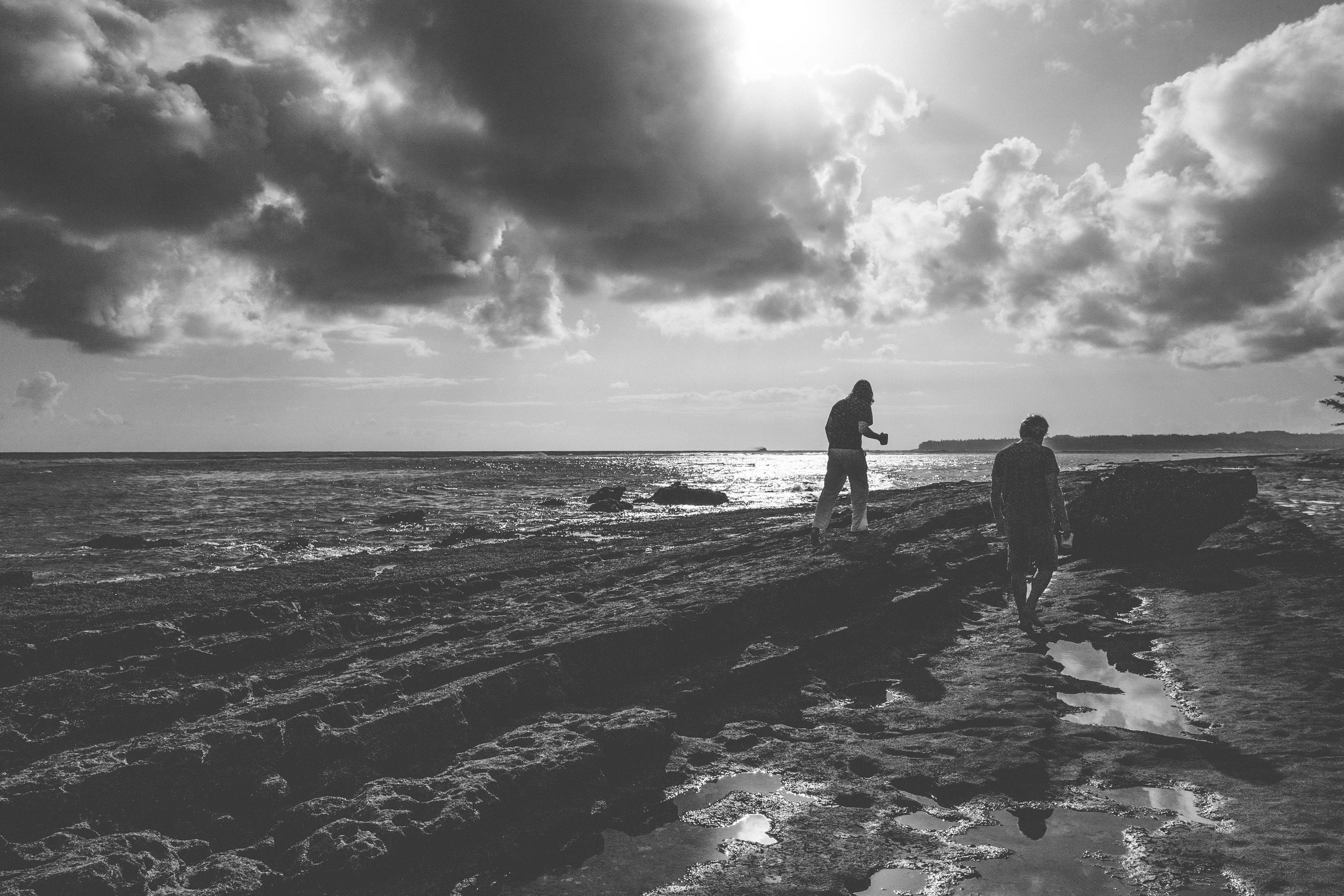 Grant and Tom taking a morning stroll on the beach, coffee in hand.  