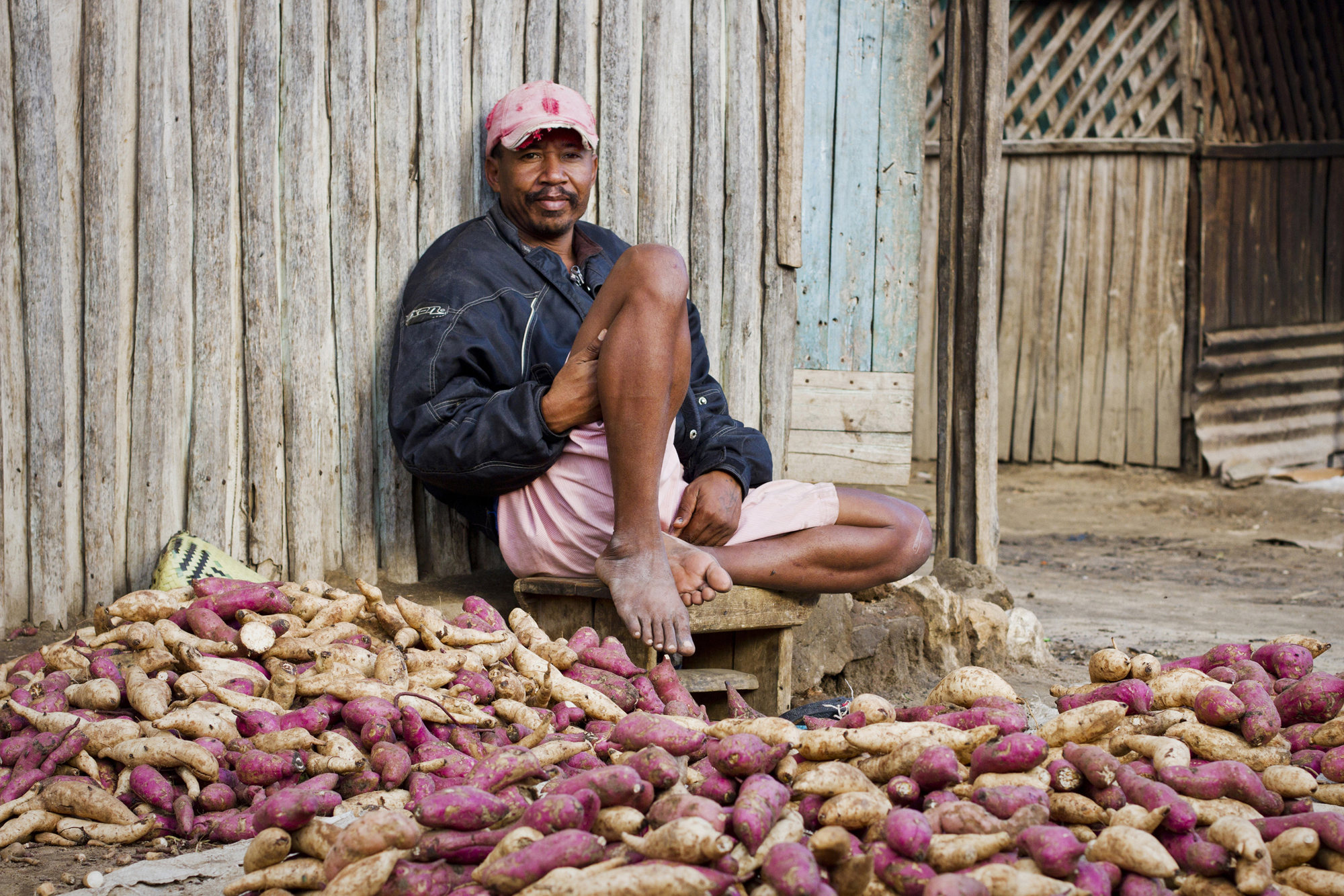 Cassava is a staple food in the south of Madagascar. Beside the roads, there are many people selling it, such as this man.