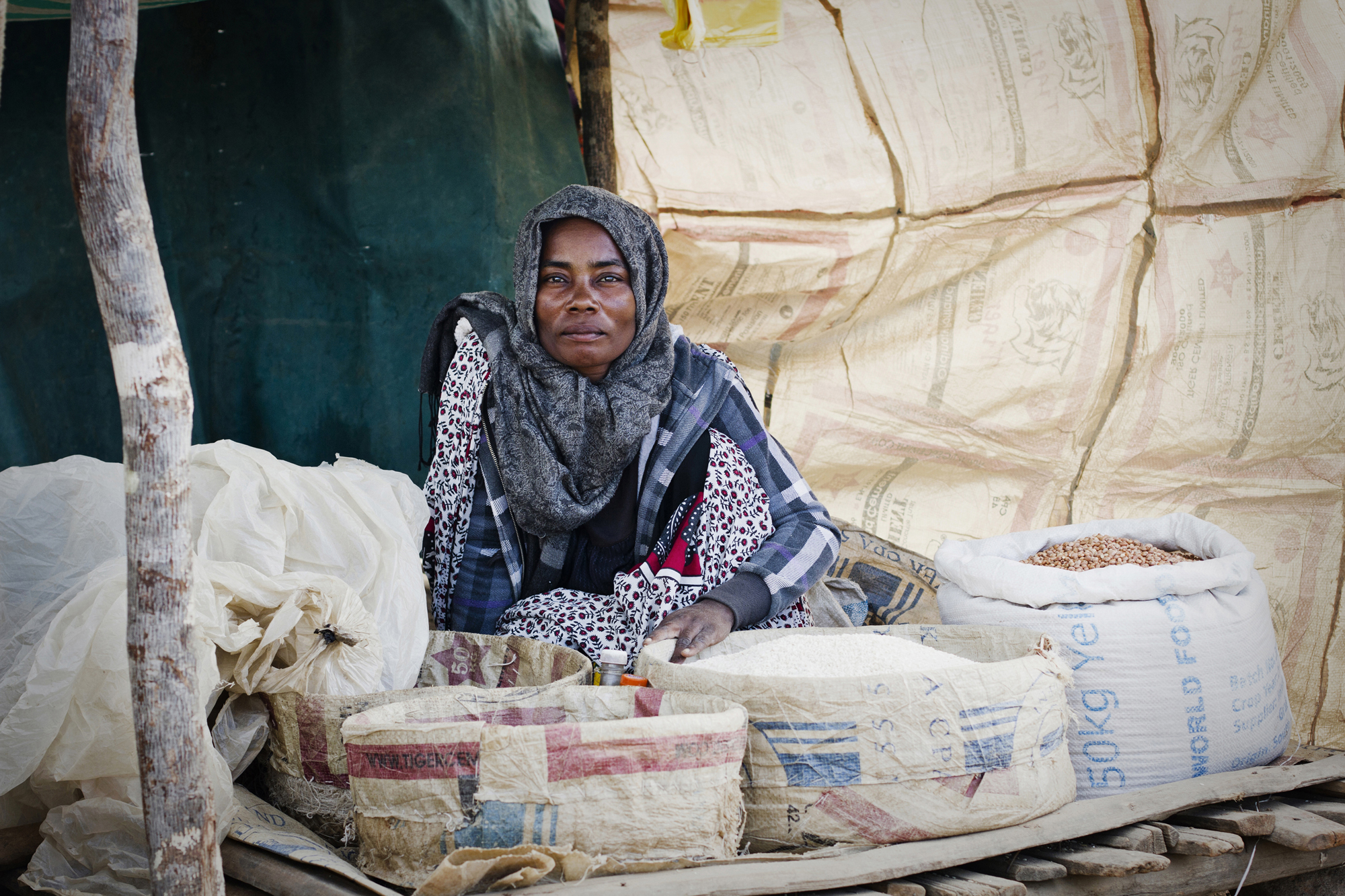Various rice and beans are sold along the road. Many Malagasy people eat rice three times a day. 