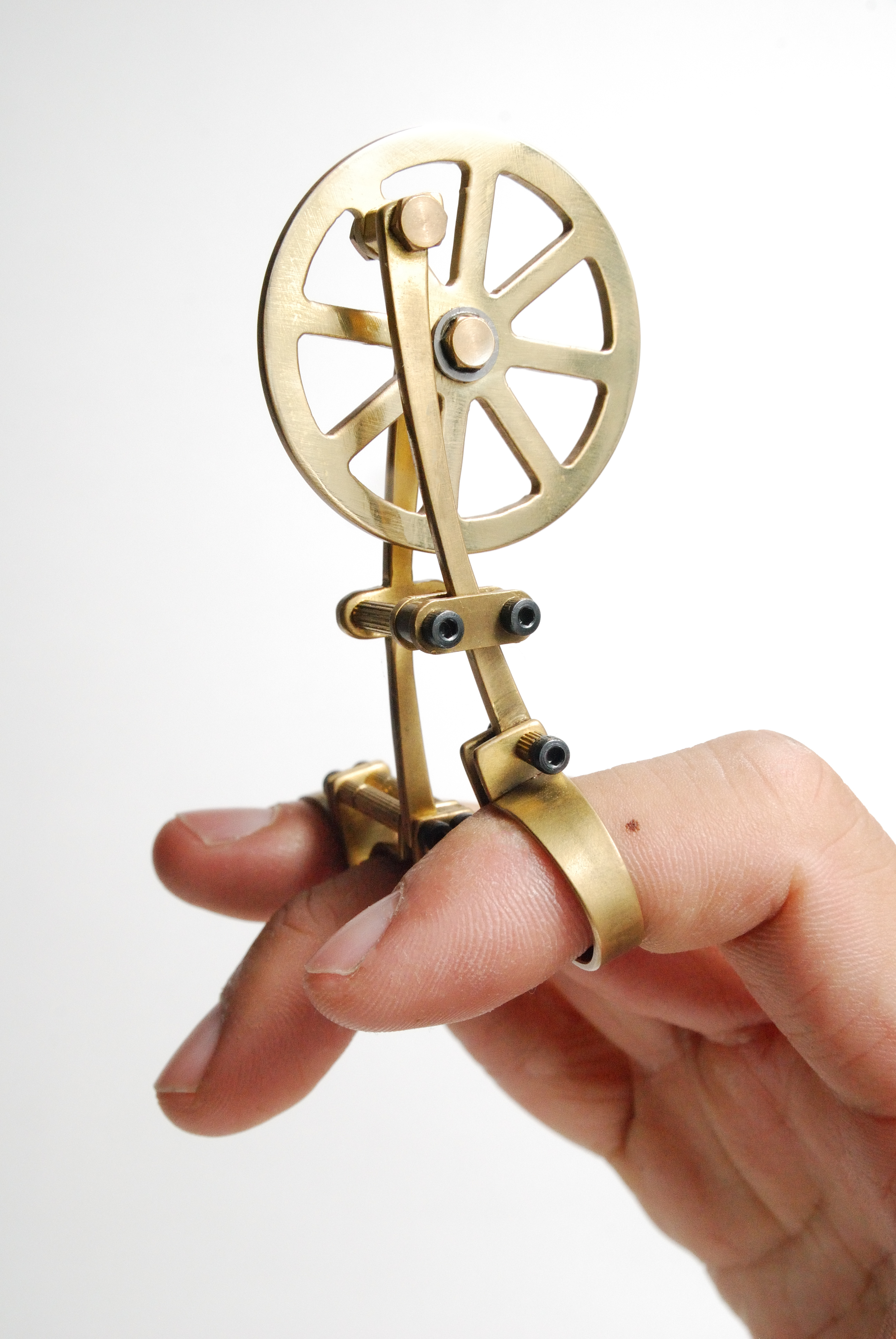 THE CHINESE DREAM OF TRAIN - LIMITATION OF BODY MOVEMENT (3), 2014 Finger-piece Brass, Stainless Steel