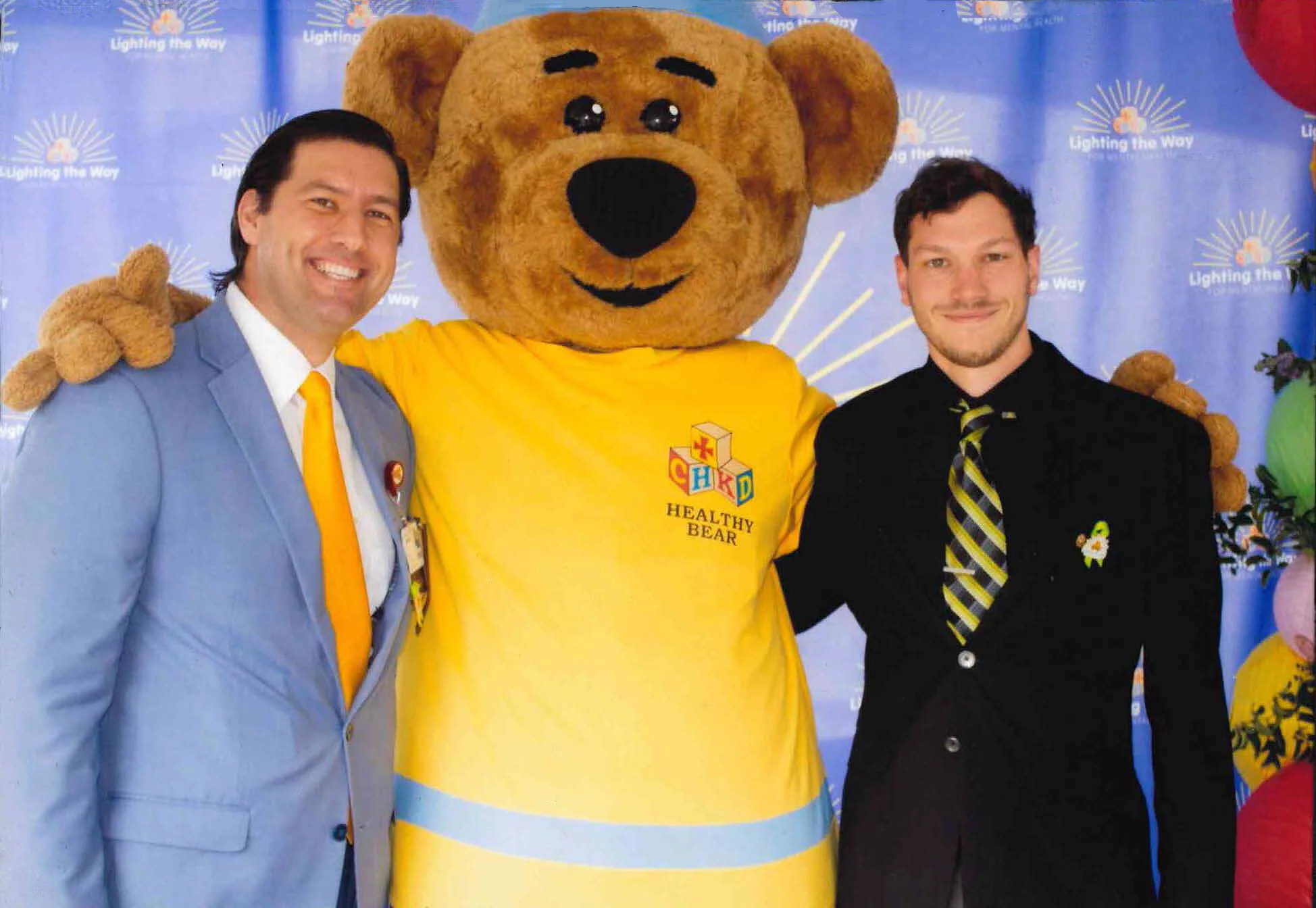 Tuna Baklan from CHKD, the CHKD Healthy Bear, and Jonathan Hiser, Project Architect