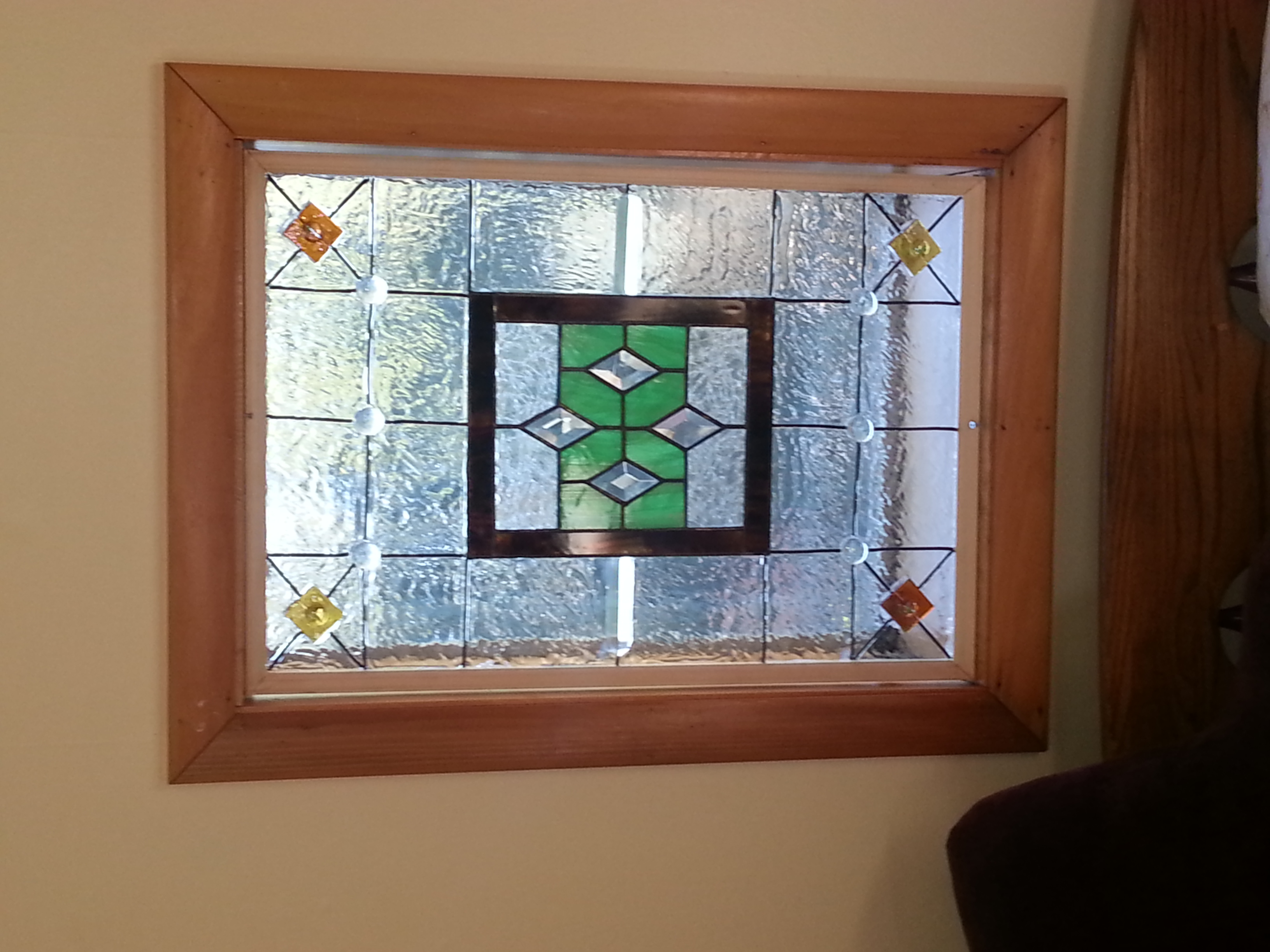 Two windows with real stained glass pieces by Jill Frederick, further embellished with glass pieces and paint.