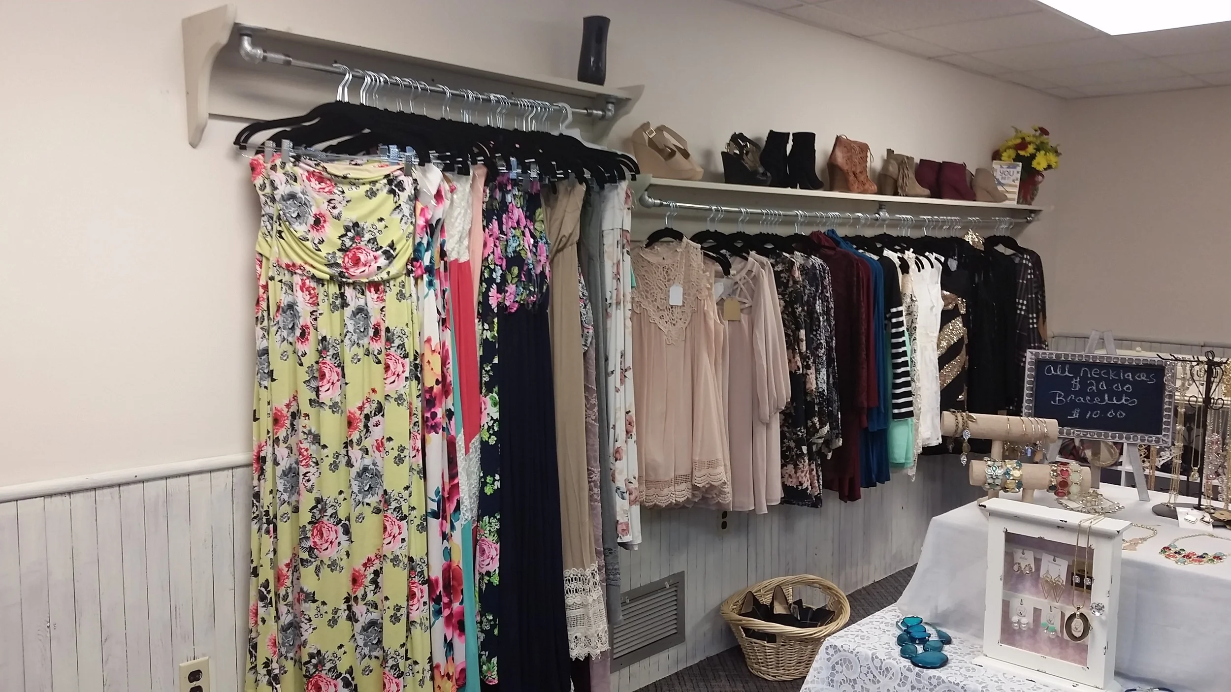 One long rack with shelf provides lots of space for hanging, then a second shelf was requested to accommodate the maxi length skirts and dresses. See how cute these clothes are?