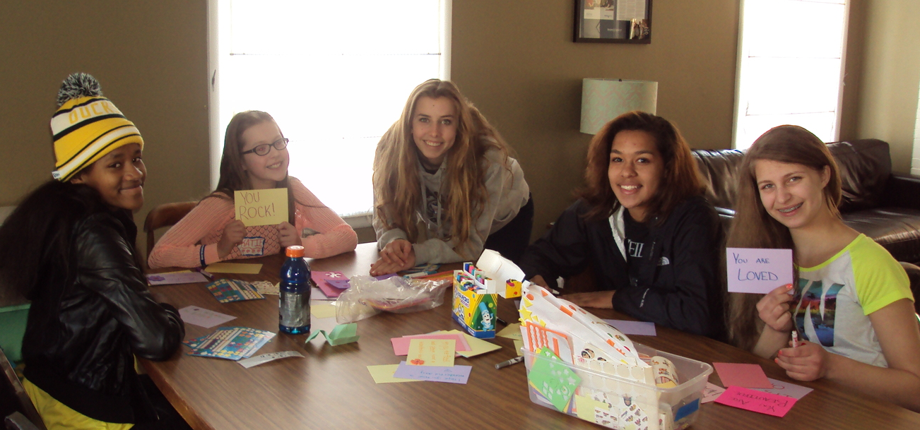 Writing notes to put in food packets.