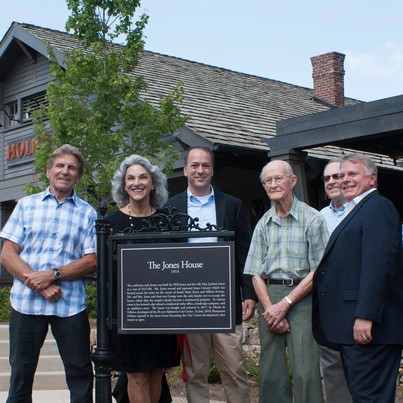 A historic marker highlights the history of the Jones House, built in 1914 and the birthplace of George Jones, third from right.