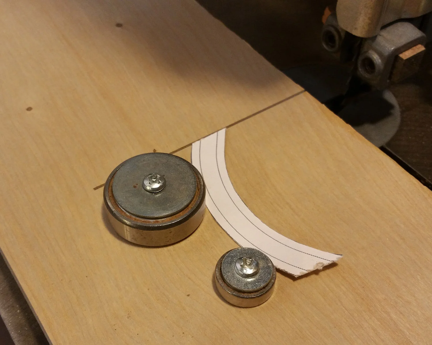 Use router bearings or other discs, and allow room for adjustment when screwing them down.