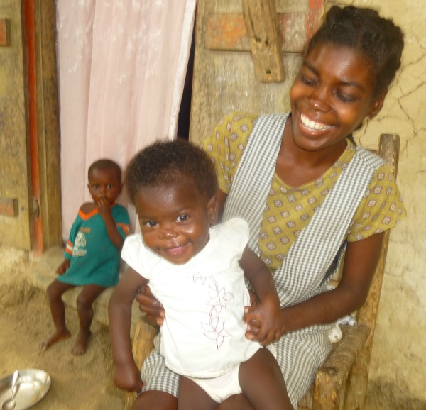 Rosna with Witchana at home, a few months after their short 15-day stay at Second Mile Haiti. 