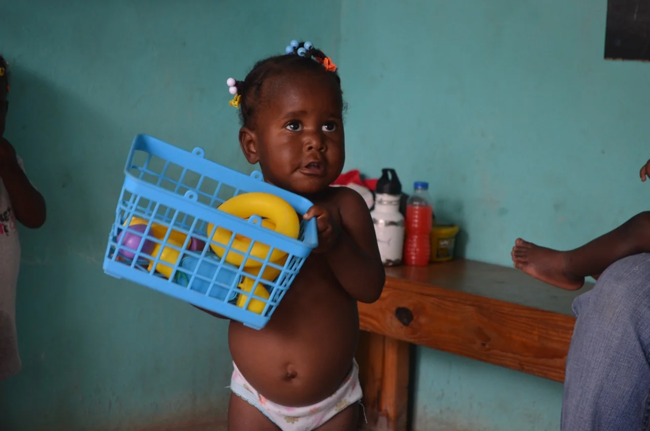 12 months after "graduation". Esther at a follow-up visit. 2 yrs old. Moms says she a great eater and sleeper and loves to talk!
