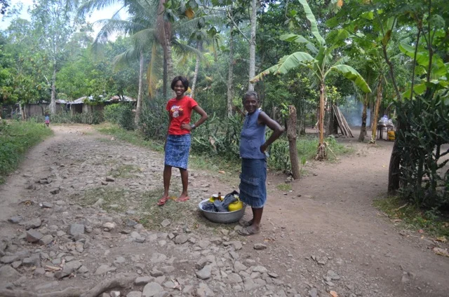 Mama Sterly and her mom, setting off to sell merchandise.