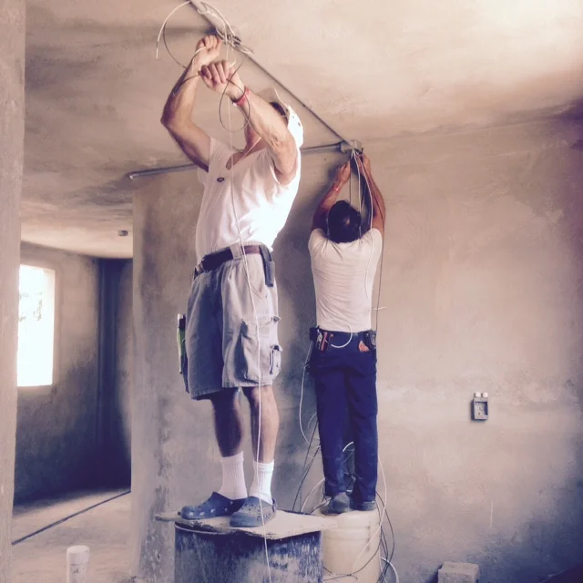 Dale and Don instal electrical wire