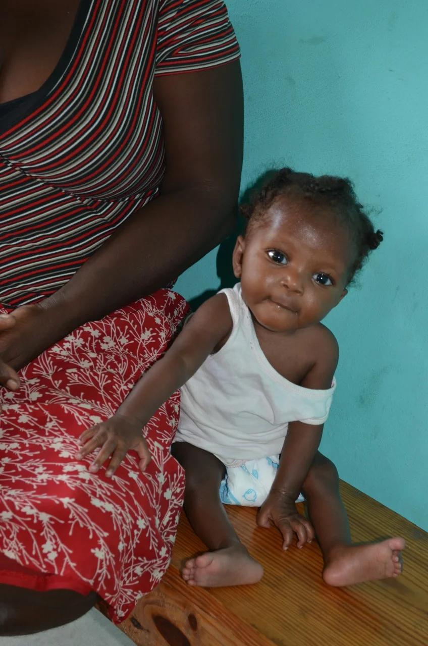 Clara sits with grandma, as all the moms and children check back in on Monday
