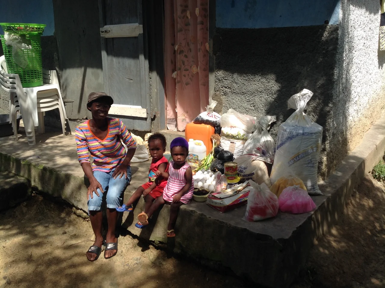 Adeline isn't selling today, but displays her goods on her stoop for a photo. 