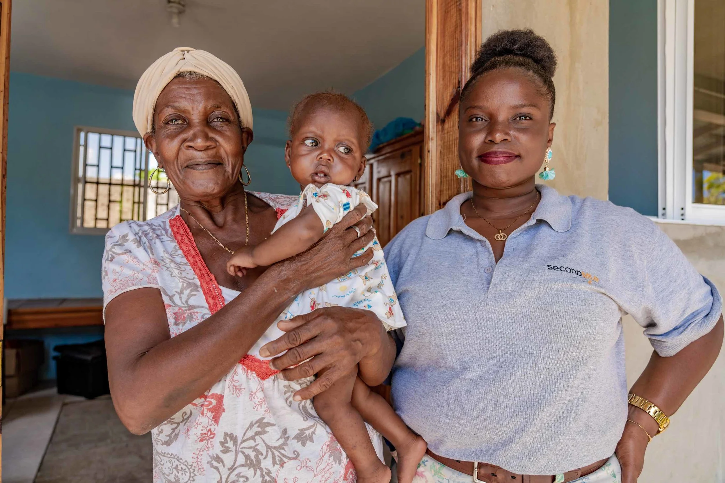 Second Mile Psychologist, Staelle, at the recovery center with caregiver Odette whose daughter died while giving birth to twin girls Christine and Christella (not pictured).