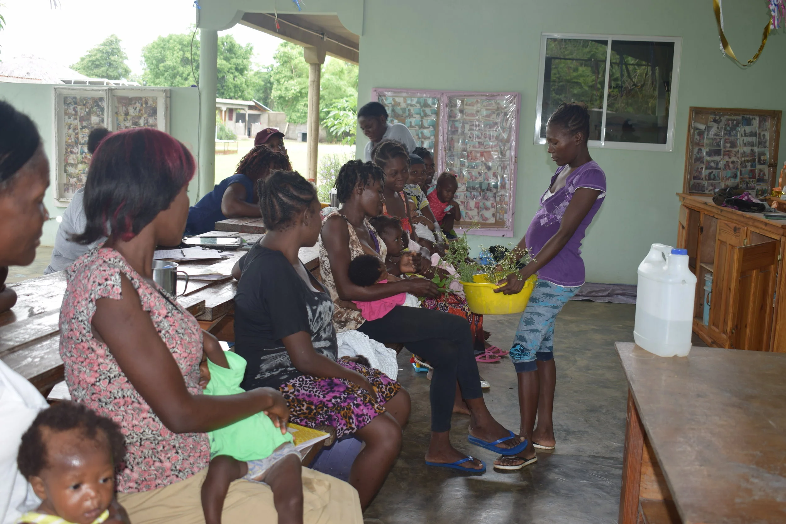 Caregivers at Second Mile Haiti’s Malnutrition Treatment Center role play in preparation for opening their small businesses