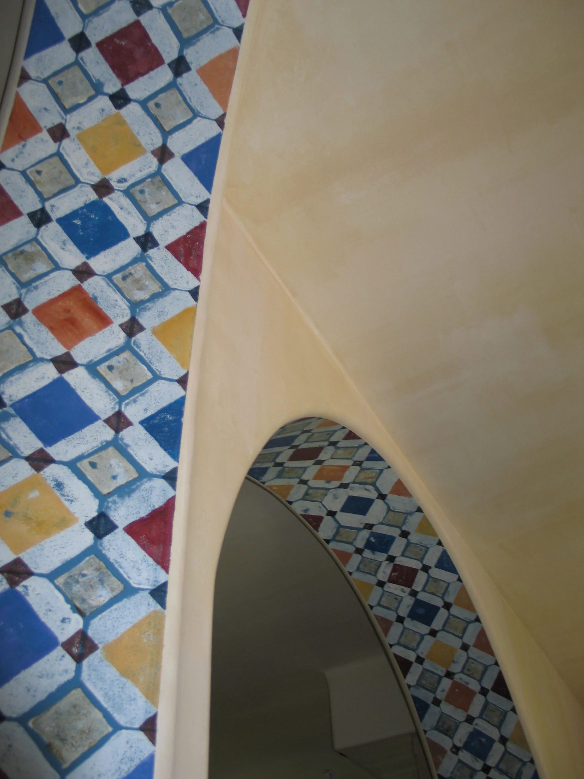 Three color glazed walls with hand painted faux-tile