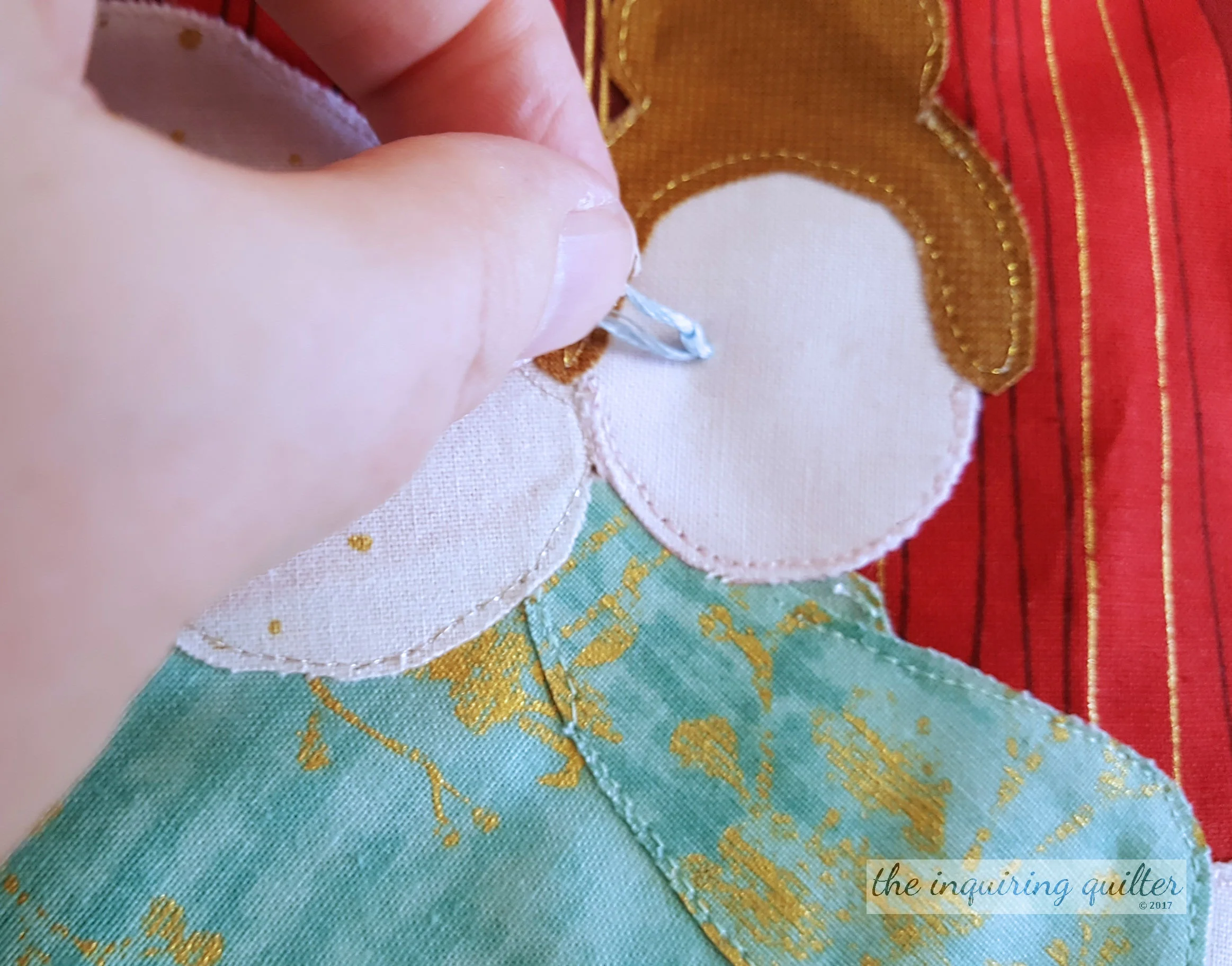 Hold onto the thread and pull from behind to form a knot.