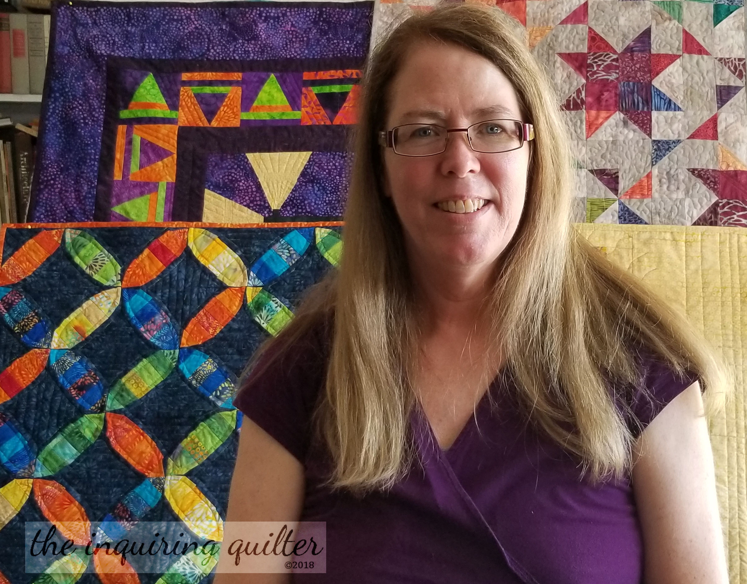 Jennifer with quilts for video 1.jpg
