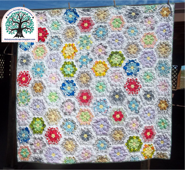 Melva quilting a Grandmothers Flower Garden 3.png