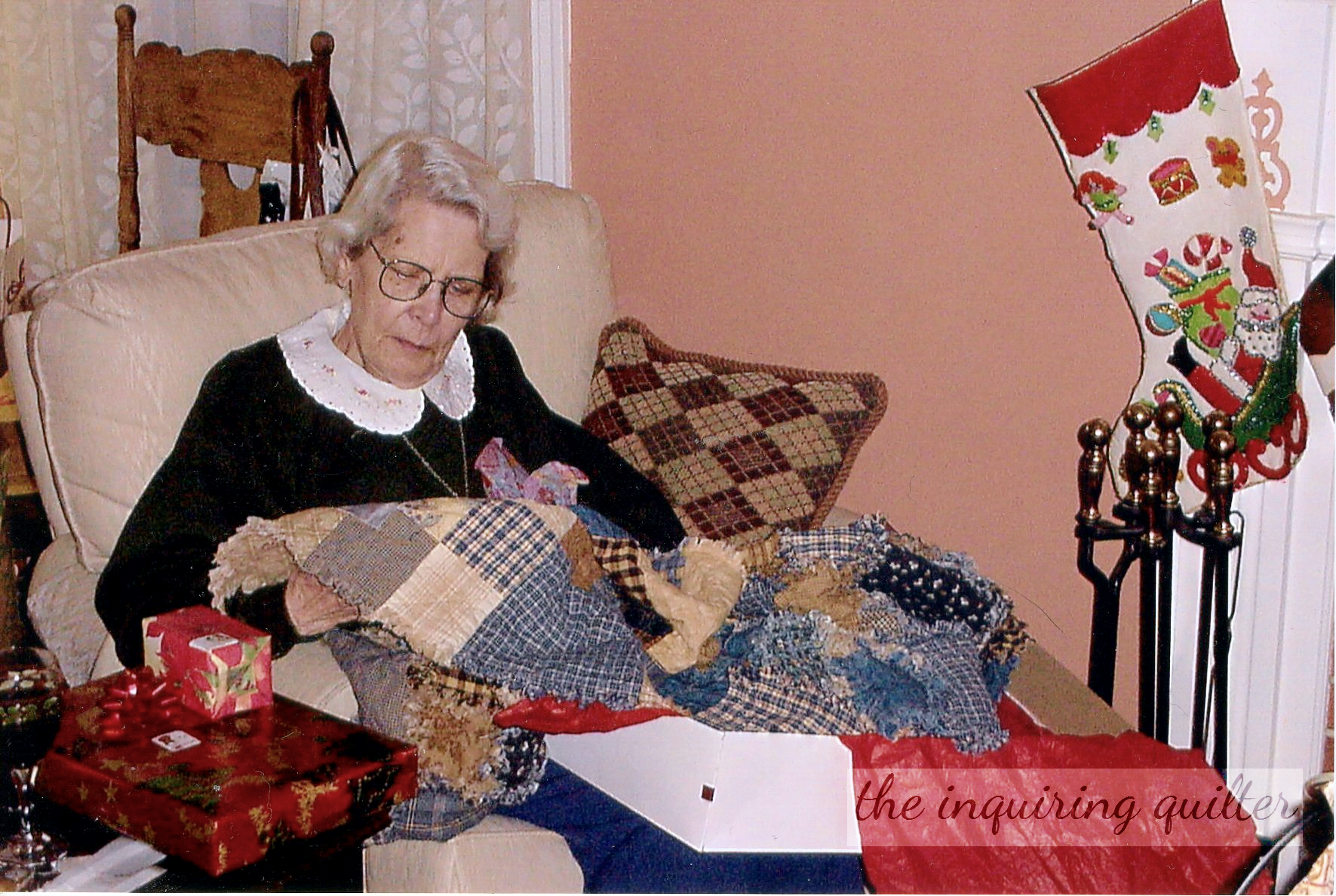 Mom admires the flannel rag quilt 002.png