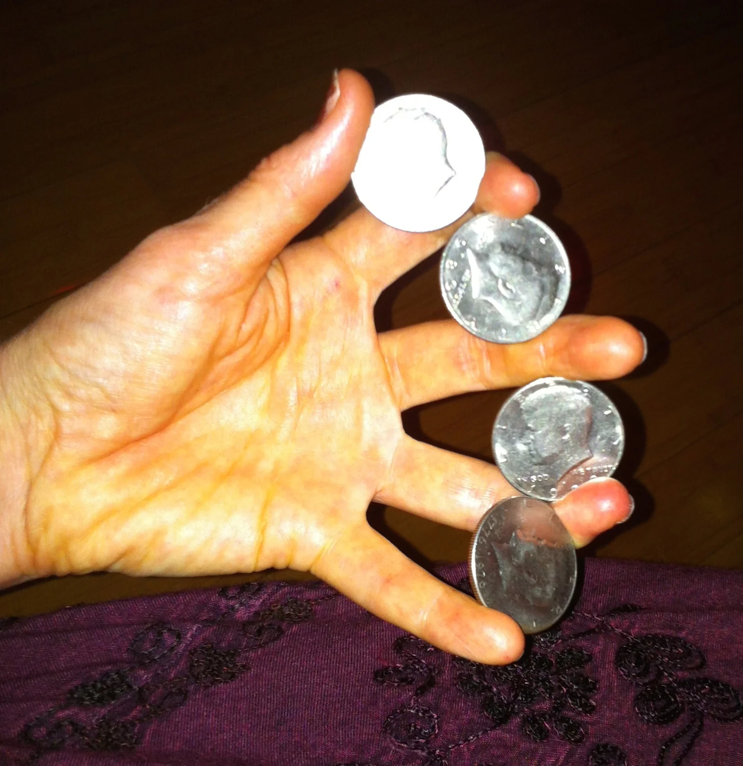 Heather_Rogers_Magician_Four_Coin_Rollout.jpg