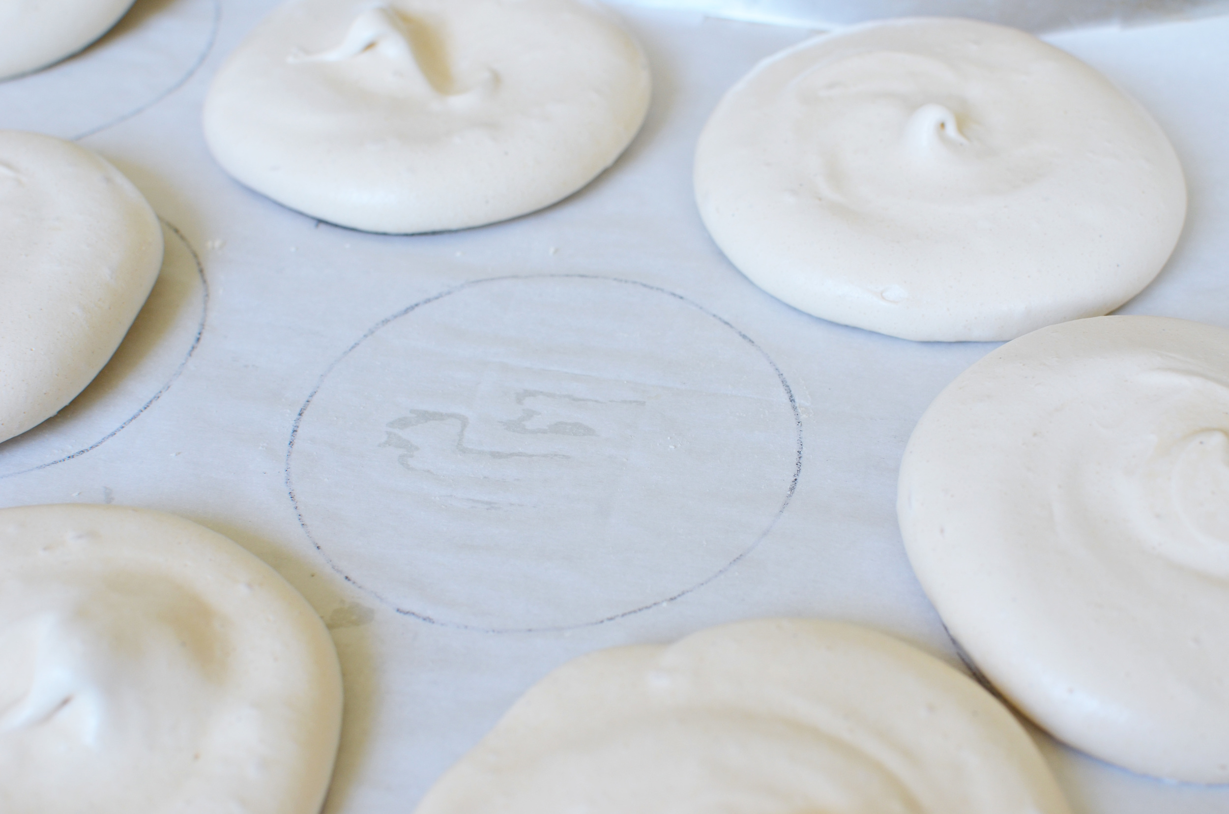 Draw 4-inch cirles on the back side of parchment paper and use as a guide so all of your pavlovas are the same size. 