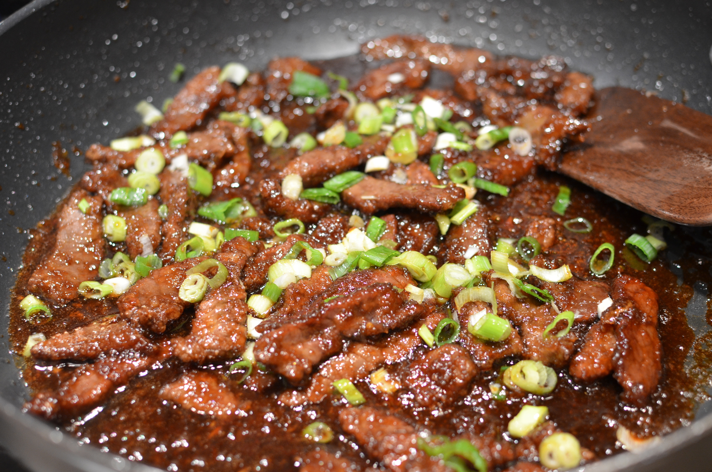 Add sliced scallions and serve.