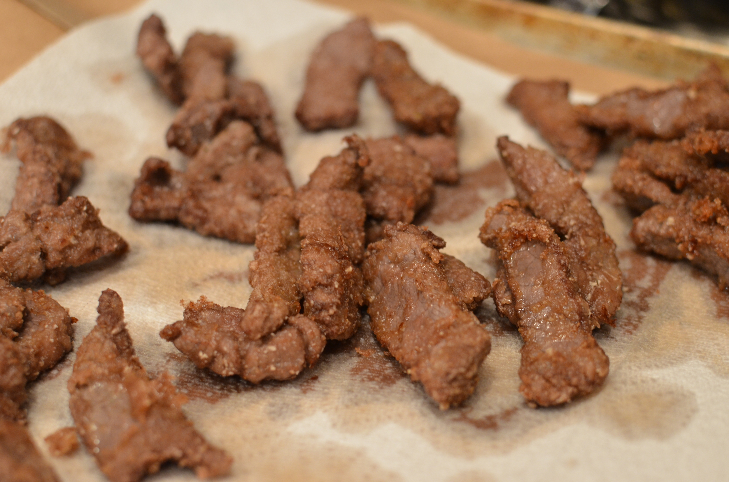 Drain steak strips on paper towels.