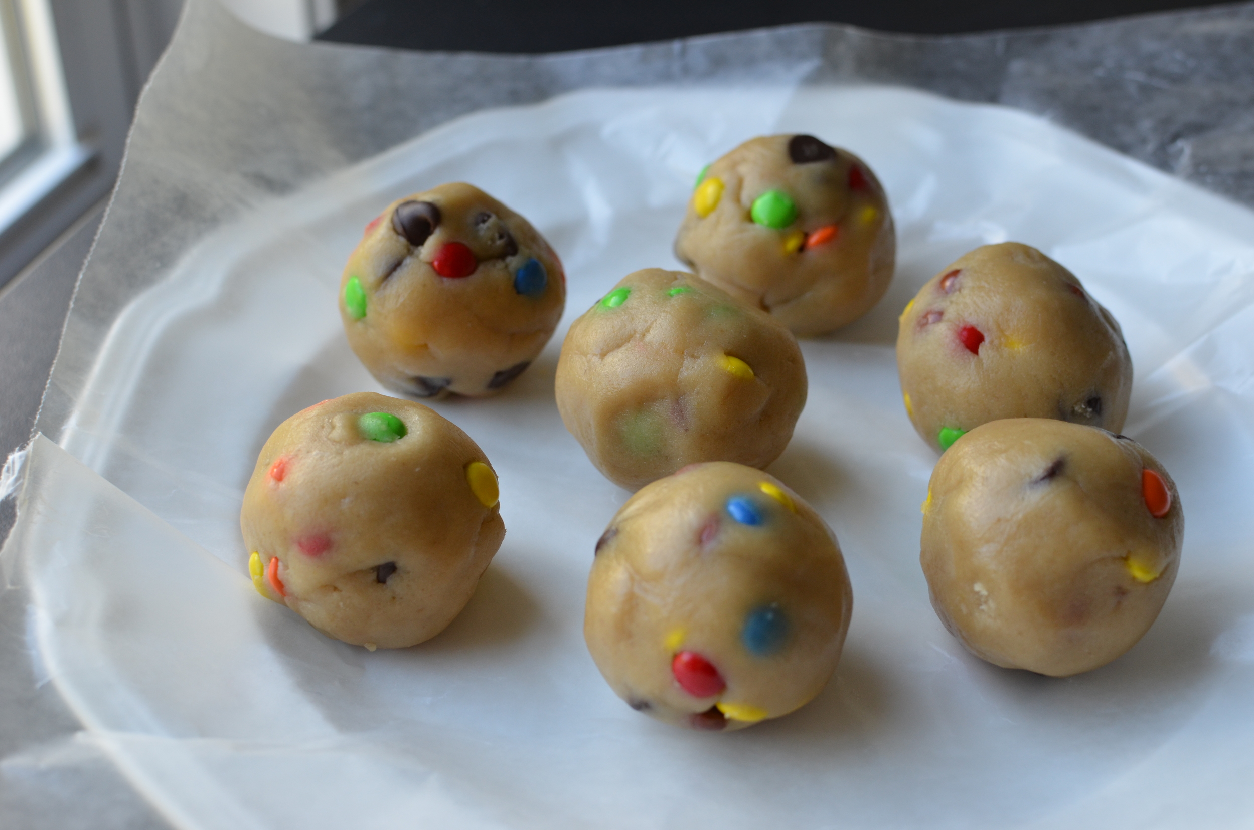 When it's time to bake the cookies, use the heat of your hands to roll the cookie dough into smooth balls.