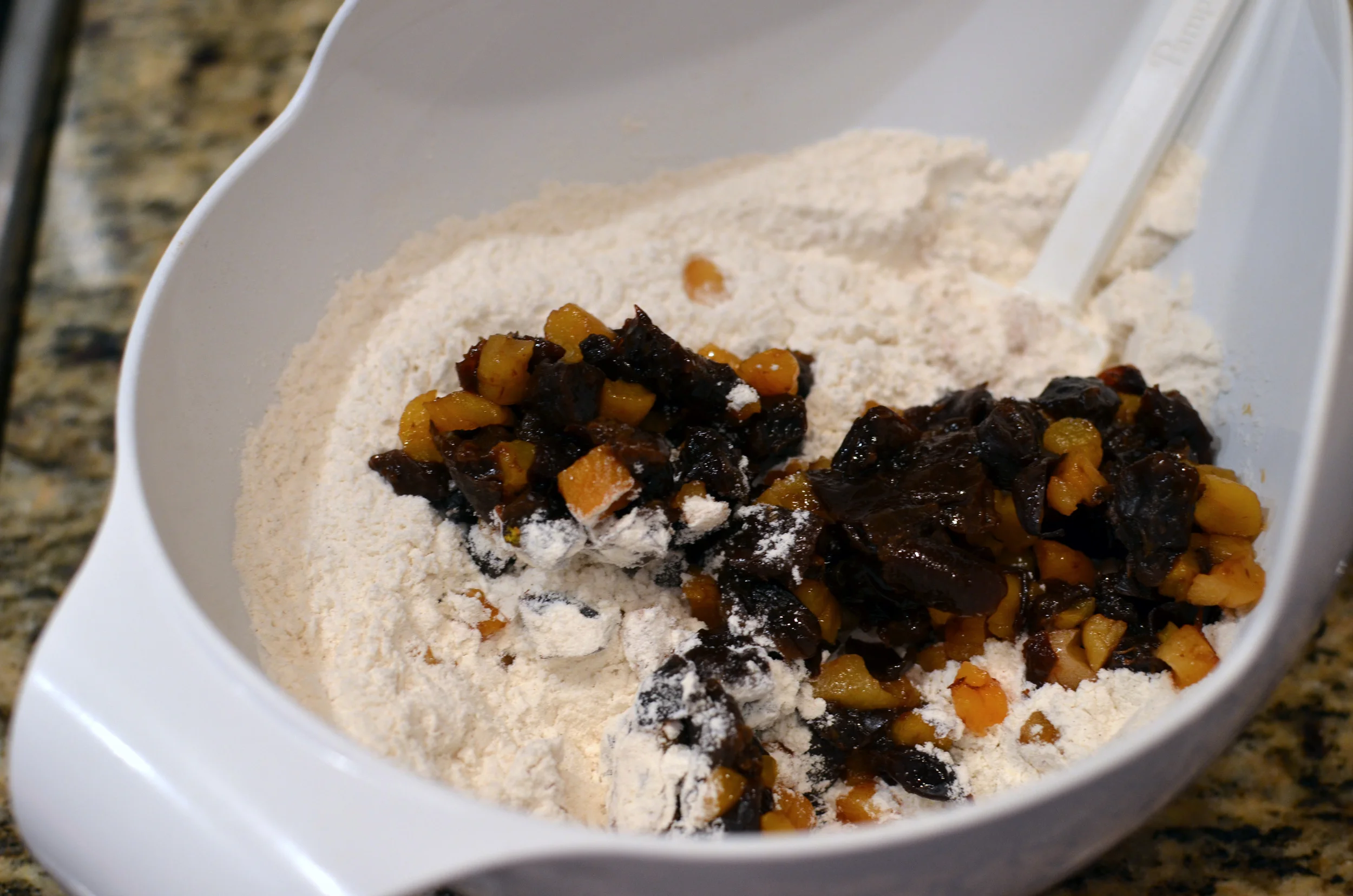 Stir the soaked fruit into the flour mixture.
