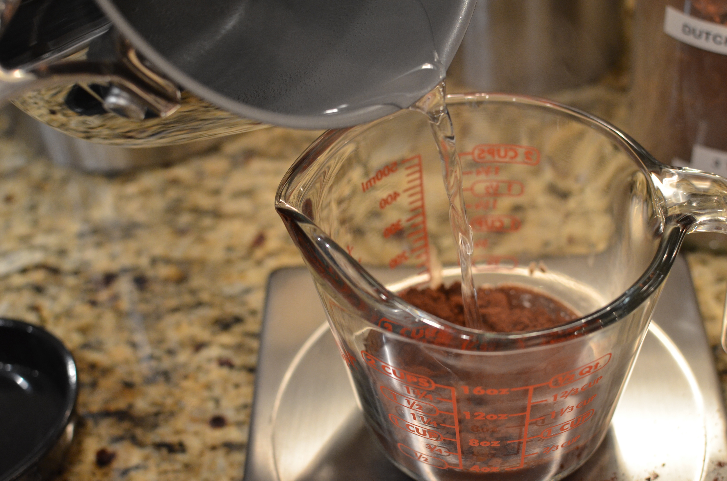 Add boiling water to the cocoa powder.