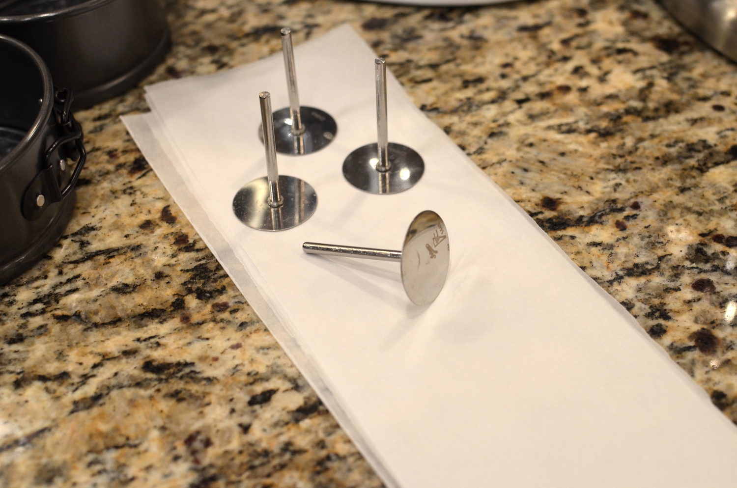 If using a 3-inch tall pan, you'll need a 3-inch tall flower nail, but I'm using mini pans so my set of 2-inch tall heating cores by Ateco will work perfectly.
