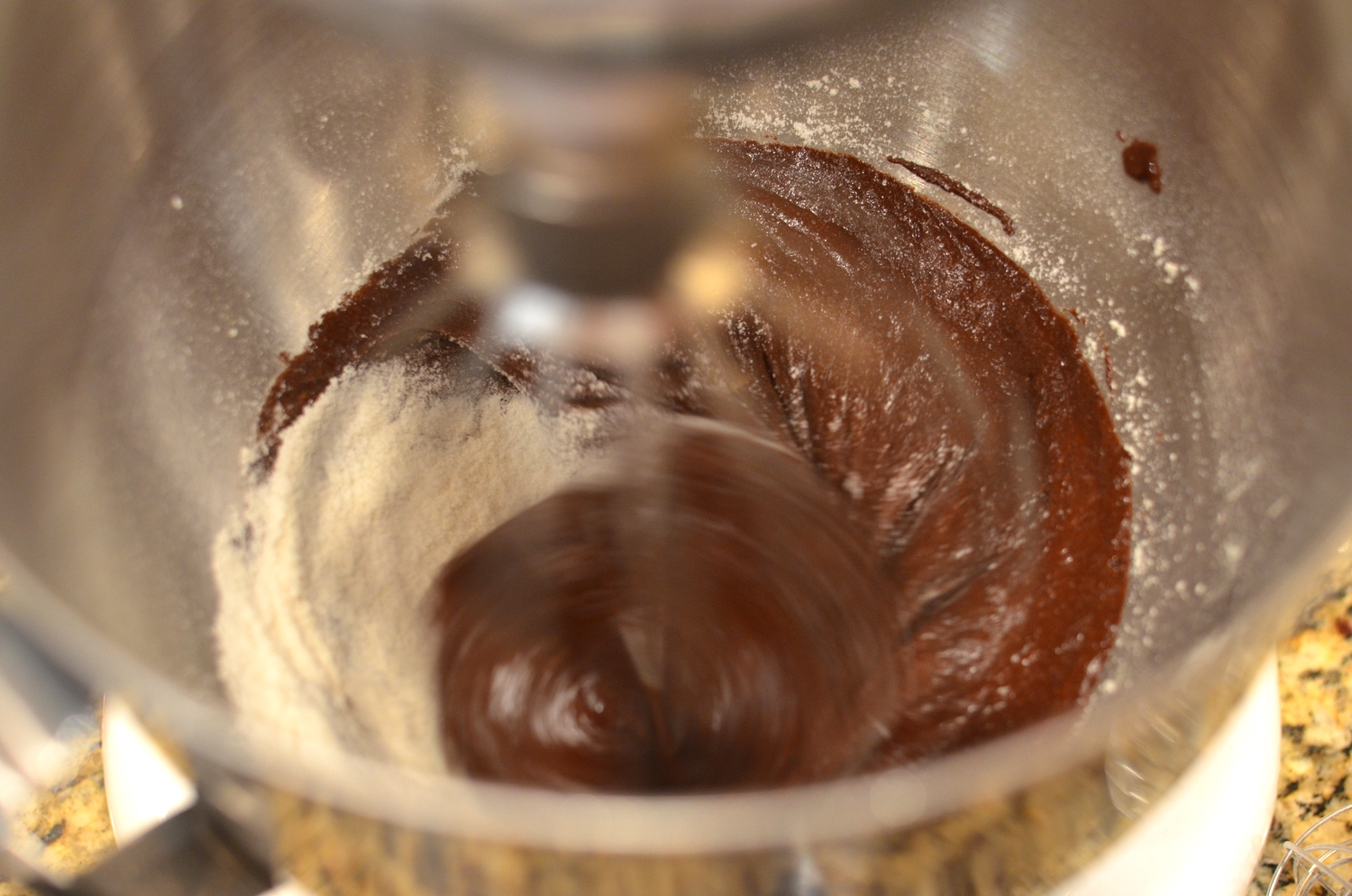 Combine the dry ingredients in the bowl of a stand mixer; add the cocoa mixture (not the chocolate ganache!!); mix as directed. If you have a second bowl and beater to whip the egg whites, great. Otherwise, wash the bowl and whip attachment very well to remove all traces of fat/oil. 