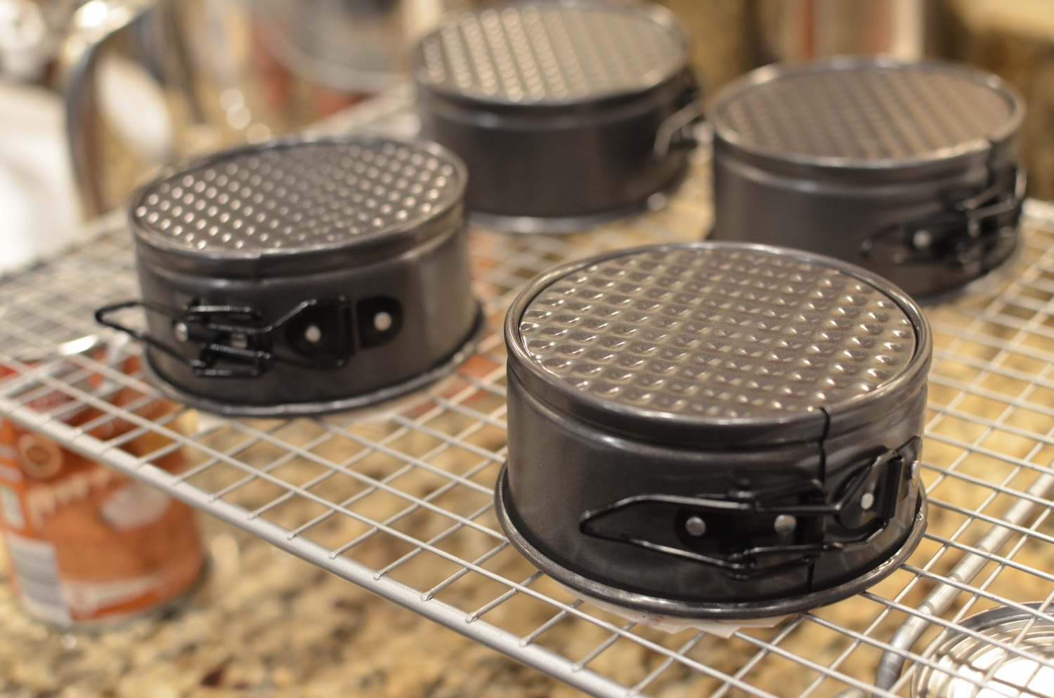 Flip cake pan(s) upside down and place on rack. Don't worry about the parchment that sticks up above the edges of the pan.