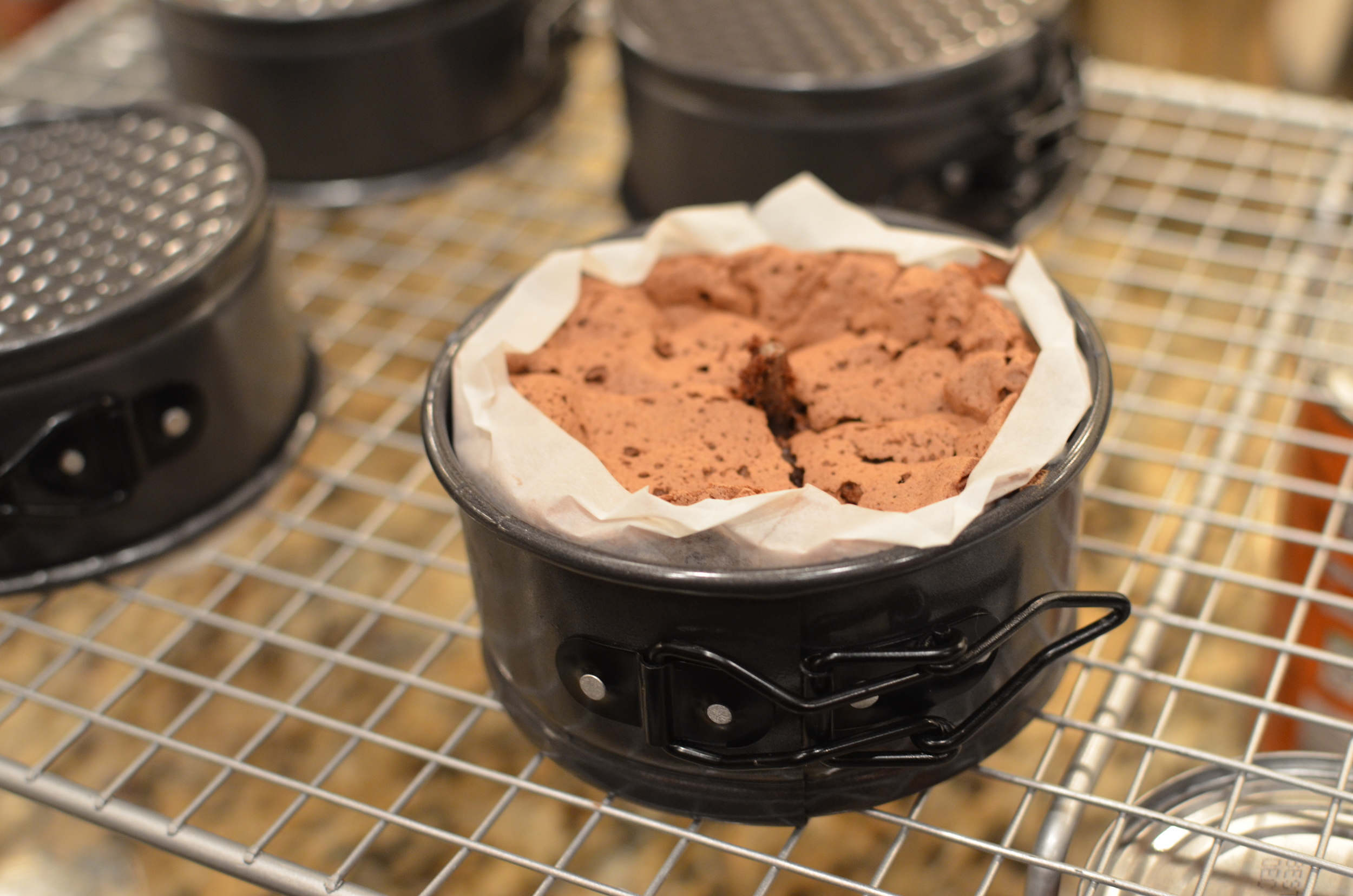 When the cake has cooled completely, remove the sides of the springform pan and gently peel the parchment paper away.