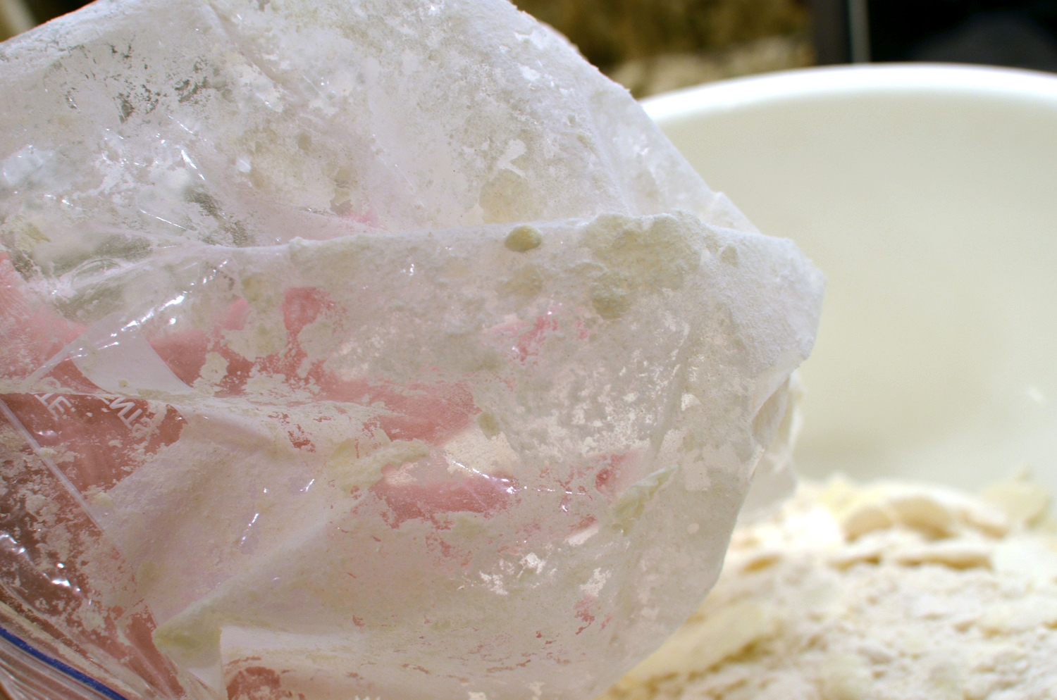 I was hoping the 10 minute stay in the freezer would enable the flattened butter slabs to release from the bag easily, but that didn't happen. I had to turn the bag inside out and pull the chunks of butter off with my fingers. There was butter all over my fingers and there was flour in the air and all over me! What a mess.