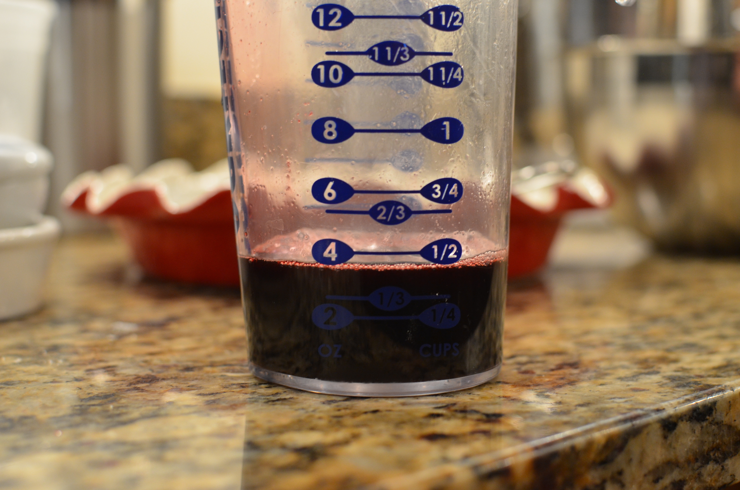 Pour the reduced juice into the berry and cornstarch mixture. I got nervous and ended up only using half of my reduction, but now that my pie is done, I think it would have been fine to add all of it.